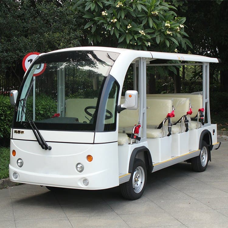 White 11 seat electric shuttle with an enclosed cab and open passenger sides
