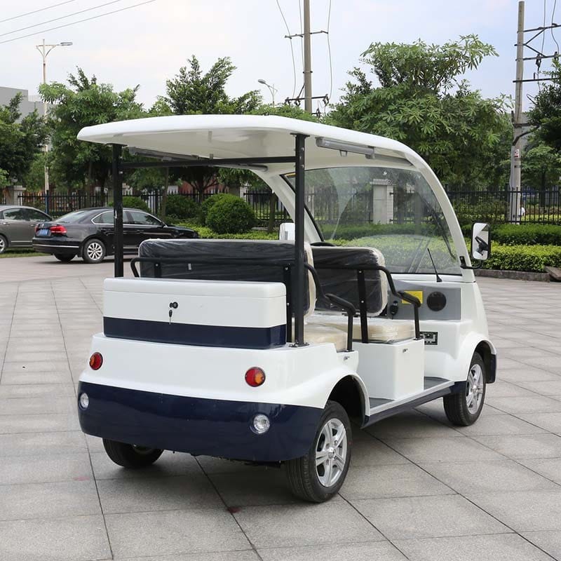 Electric sightseeing vehicle seating four to six under a hard roof