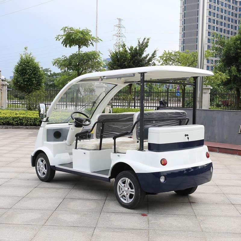 Electric sightseeing vehicle seating four to six under a hard roof