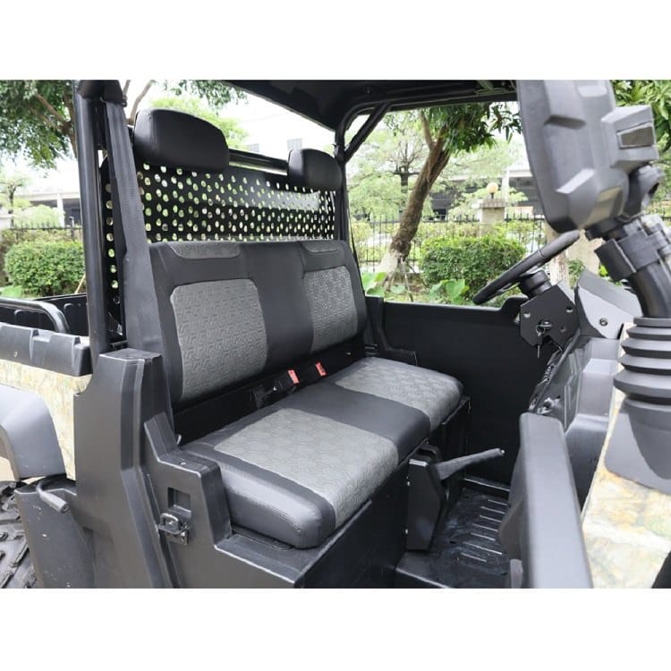 Bench seat and controls inside the 2 seater electric UTV