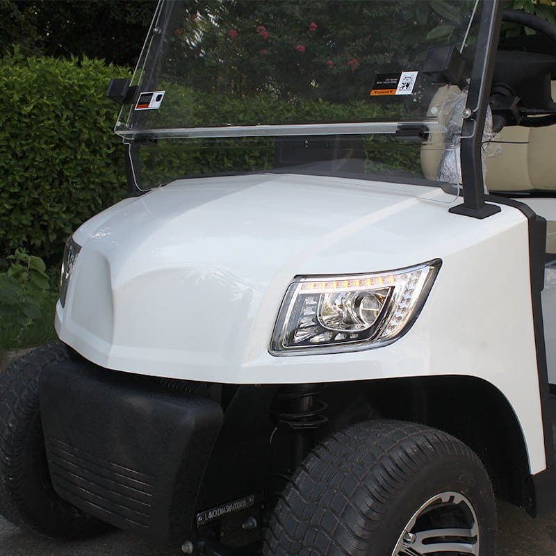 4 seater electric golf buggy with a rear flip seat that folds into a load bed