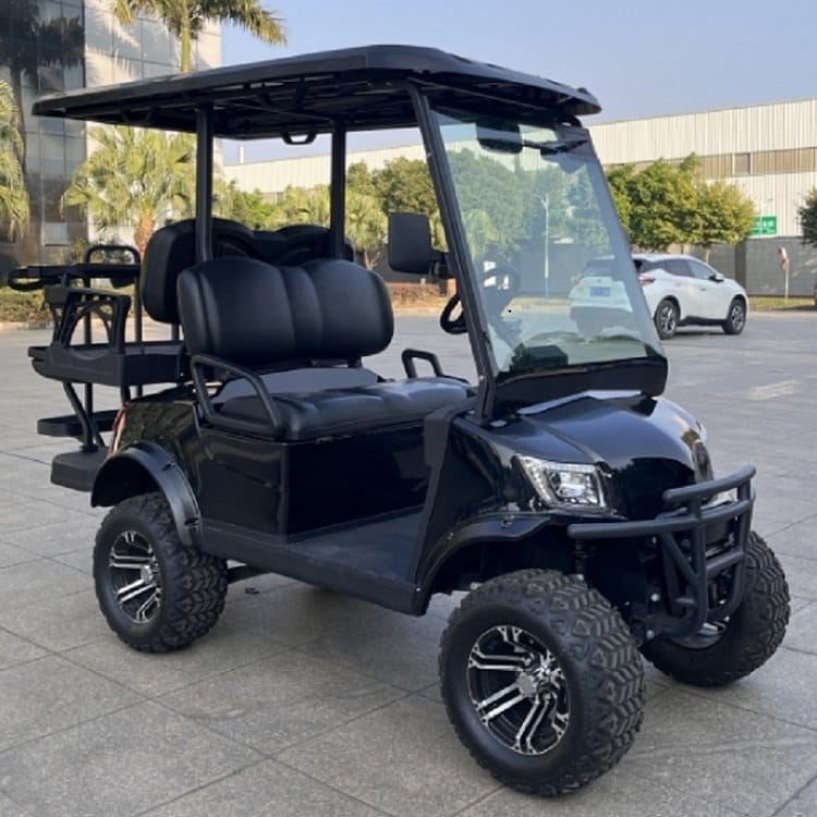 Black lifted 4 seater electric golf buggy on all terrain tyres with a rear flip seat