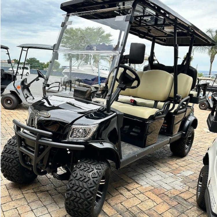 Lifted 6 seater electric golf buggy with a rear flip seat